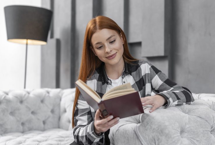 lovely-woman-reading-book-indoors